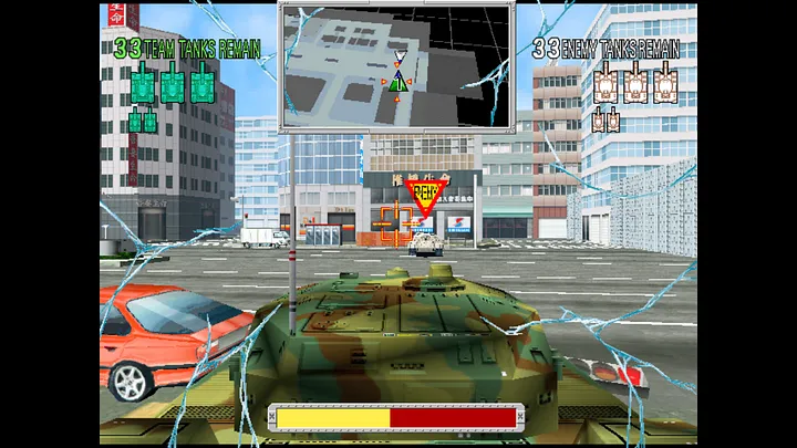 A Screenshot of Tank Wars. The camera is sitting just behind the turret of a tank painted with green Camouflage, which is targeting a white tank in the distance with a yellow and red ‘enemy’ label above it. The background is a a large multi-lane rtoad in the middle of a city, with buildings in the background.