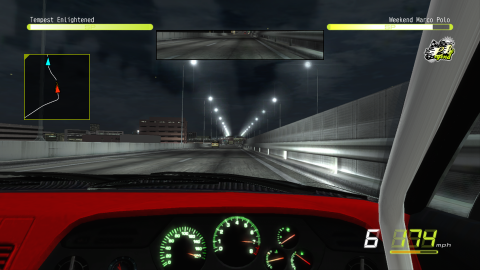 Sitting in a cockpit! a first person car racing experience looking out on a grey concrete road and dark sky. The dashboard has green gagues with orange needles.